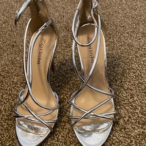 Silver woman’s heels wore them once